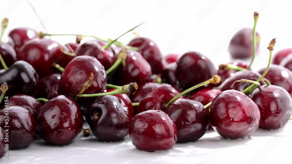 Sweet red cherries are being sprayed with cold water. Slow sliding movement. Sweet red cherries are being sprayed with cold water. Slow sliding movement.