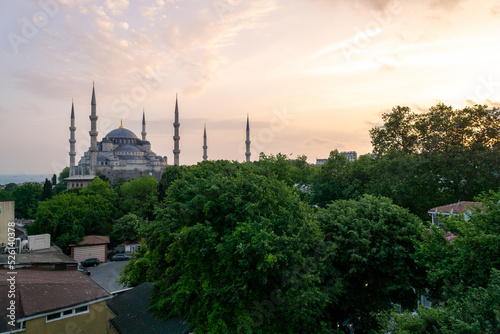 Blue Mosque in Istanbul, seen from a terrace at sunset.