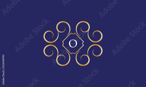 Abstract logo sign with letter O in the center. Gold monogram on a blue background photo