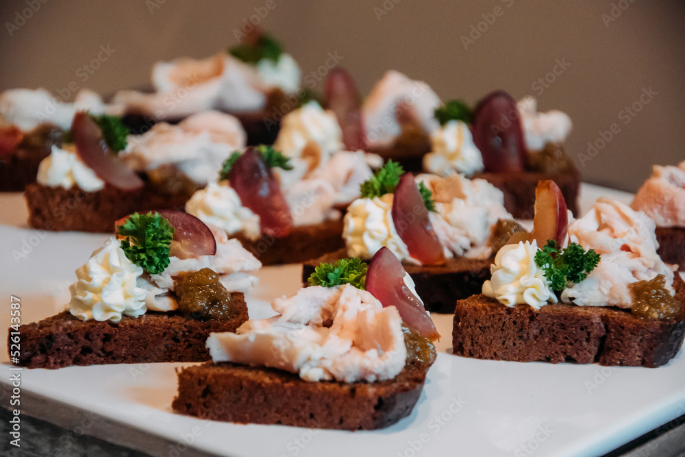 Appetizing sandwiches with meat slices, herbs and white sauce. Appetizing sandwiches with meat slices, herbs and white sauce.
