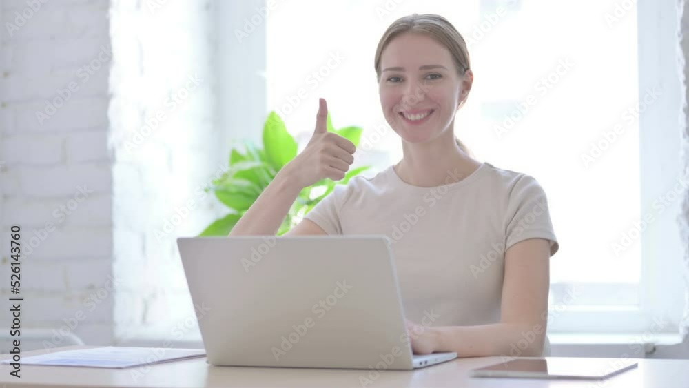 Thumbs Up by Woman Working on Laptop Thumbs Up by Woman Working on Laptop