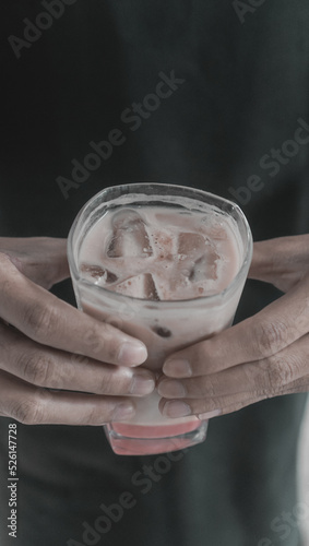 hand with glass of juice