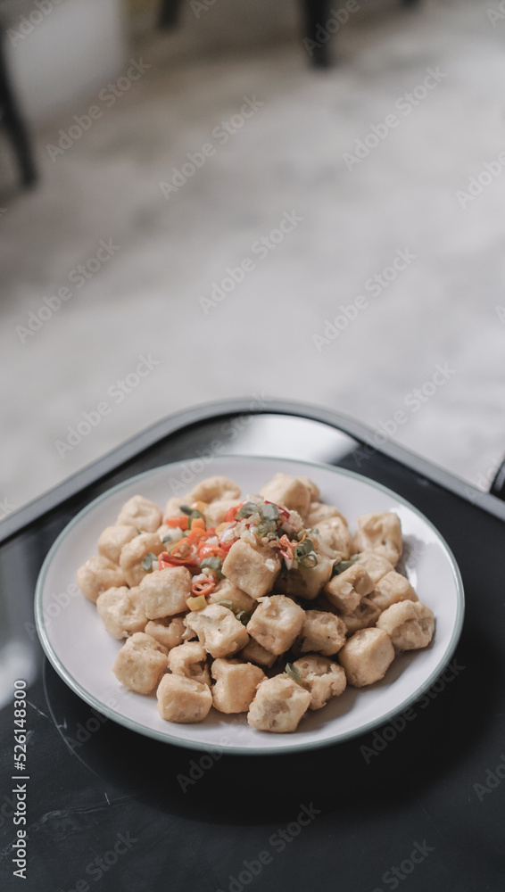 fried tofu crispy on a plate with chili fried tofu crispy on a plate with chili