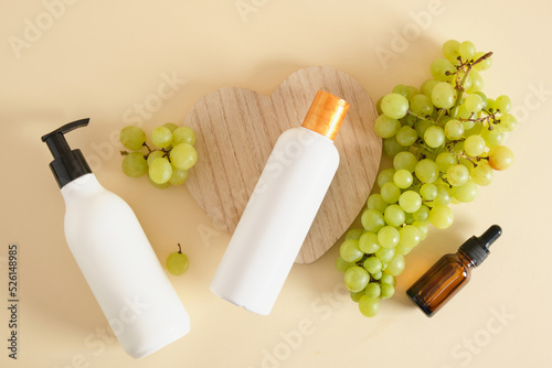 differrent mock up bottles with natural cosmetic with grapes extract photo