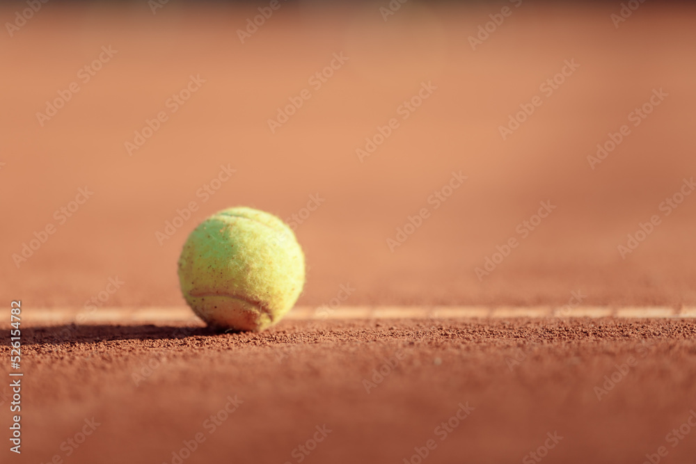 tennis ball on a clay court
