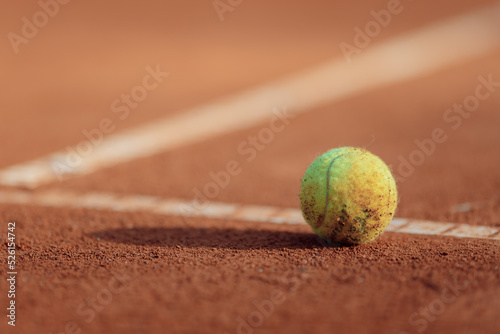 tennis ball on a clay court