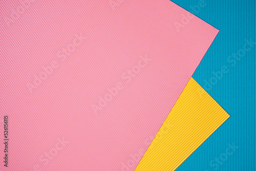 Blue, pink and orange three tone color paper background with stripes. Abstract background modern hipster futuristic. Texture design