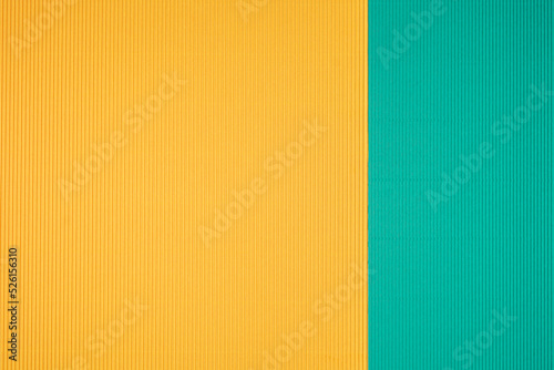 Turquoise and orange two tone color paper background with stripes. Abstract background modern hipster futuristic. Texture design