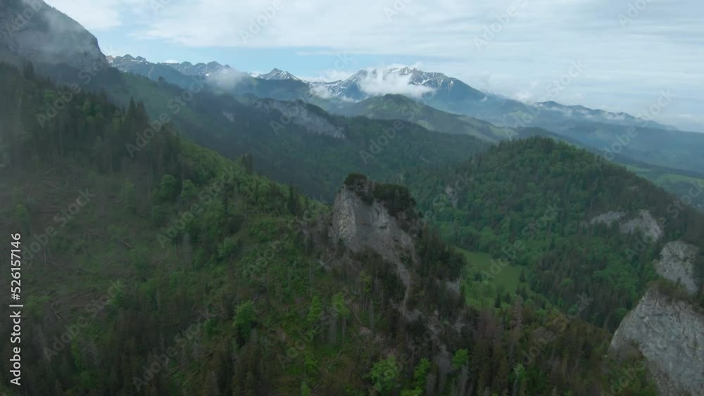 Flying through the clouds, close to the rocks. High Tatras, Slovakia Flying through the clouds, close to the rocks. High Tatras, Slovakia