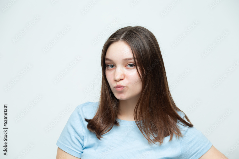 Confident caucasian girl posing and looking at the camera. Confident caucasian girl posing and looking at the camera.