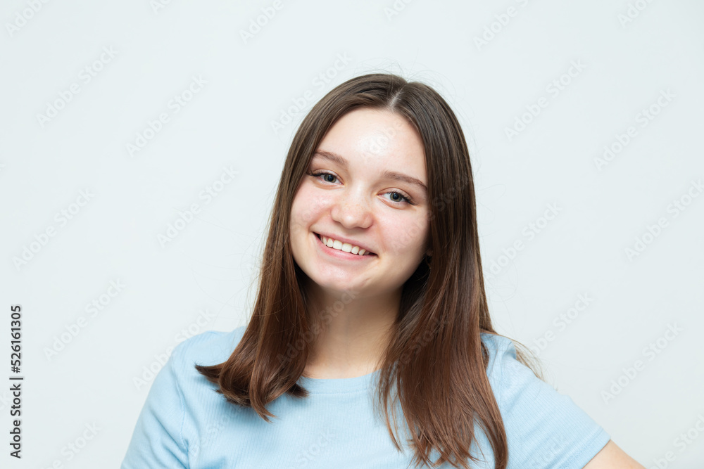 Cheerful caucasian girl posing and looking at the camera. Cheerful caucasian girl posing and looking at the camera.