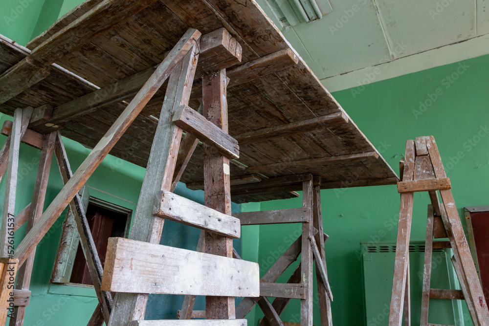 A fragment of the classroom interior with desks and construction equipment for repair