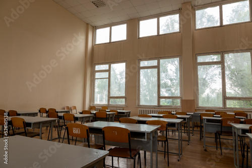A fragment of the interior of the classroom with desks in an educational institution