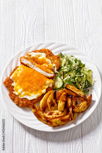 chicken parmo with coleslaw and roast potatoes
