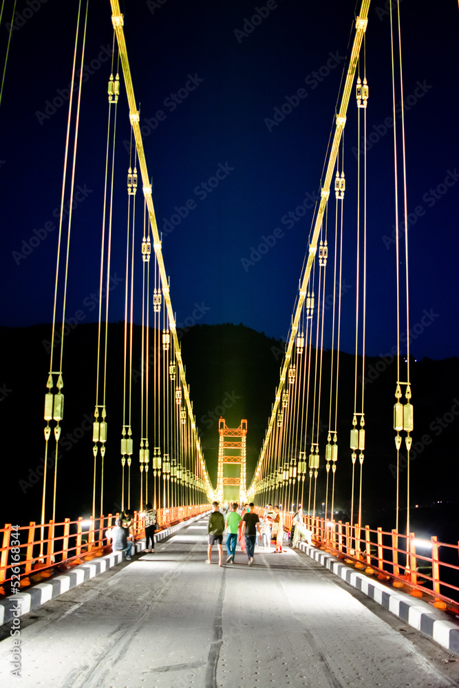 Colourful Dobra Chanti hanging bridge over Tehri Lake. Night view of Dobra-Chanti bridge. The 725-metre long Dobra Chanti suspension bridge over the Tehri lake. 
