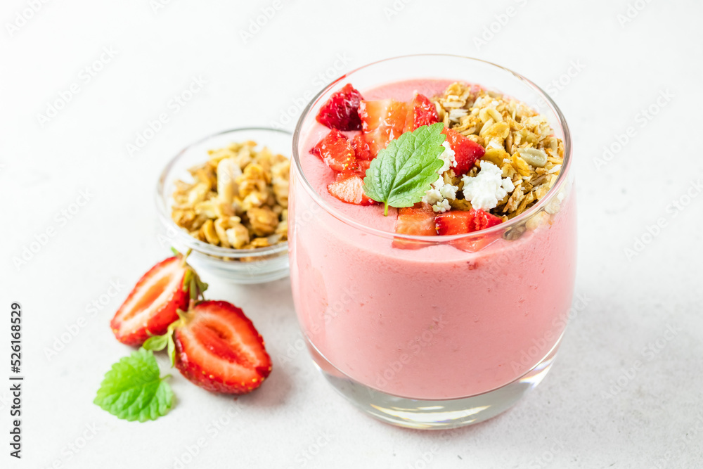 Healthy strawberry oatmeal granola yogurt dessert in glasses. Copy space, flat lay. Healthy strawberry oatmeal granola yogurt dessert in glasses. Copy space, flat lay.
