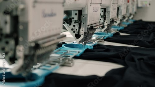Modern and automatic high technology sewing machine for textile or clothing apparel making manufacturing process in industrial. Close up Computerized embroidery machines