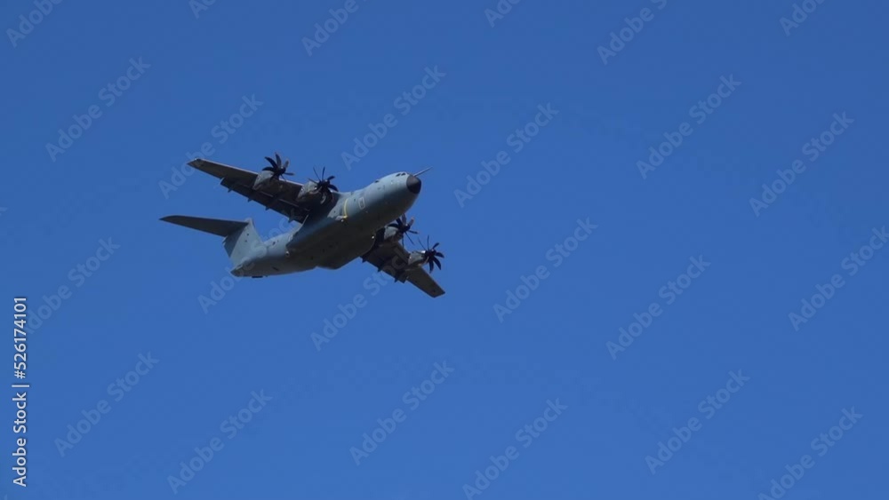 Royal Air Force Airbus A400M Atlas military plane (RAF ZM414) flying low level dropping 3 PARA parachute regiment soldiers on an airborne assault military exercise, summer bright cloud sky Royal Air Force Airbus A400M Atlas military plane (RAF ZM414) flying low level dropping 3 PARA parachute regiment soldiers on an airborne assault military exercise, summer bright cloud sky