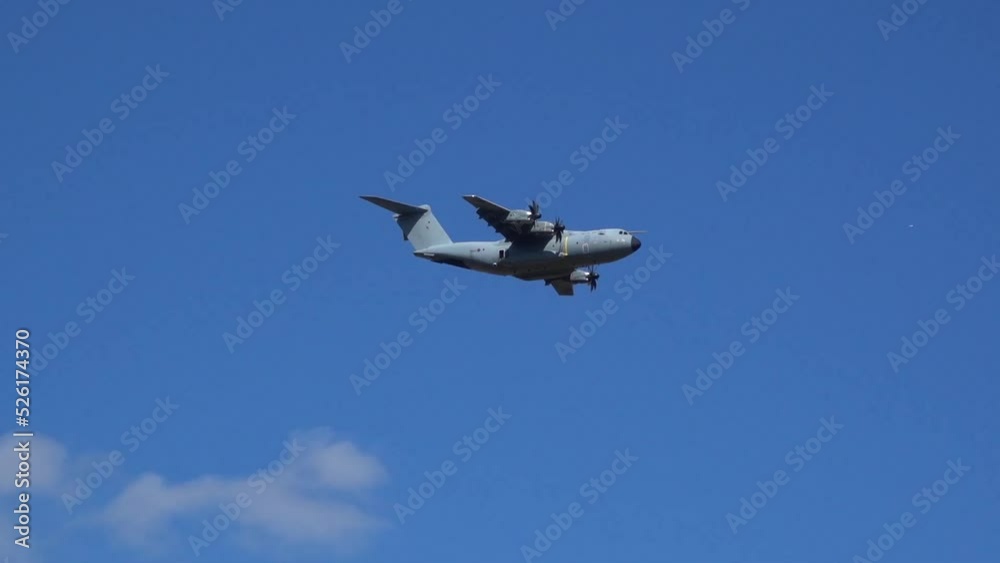 Royal Air Force Airbus A400M Atlas military plane (RAF ZM414) flying low level dropping 3 PARA parachute regiment soldiers on an airborne assault military exercise, summer bright cloud sky Royal Air Force Airbus A400M Atlas military plane (RAF ZM414) flying low level dropping 3 PARA parachute regiment soldiers on an airborne assault military exercise, summer bright cloud sky