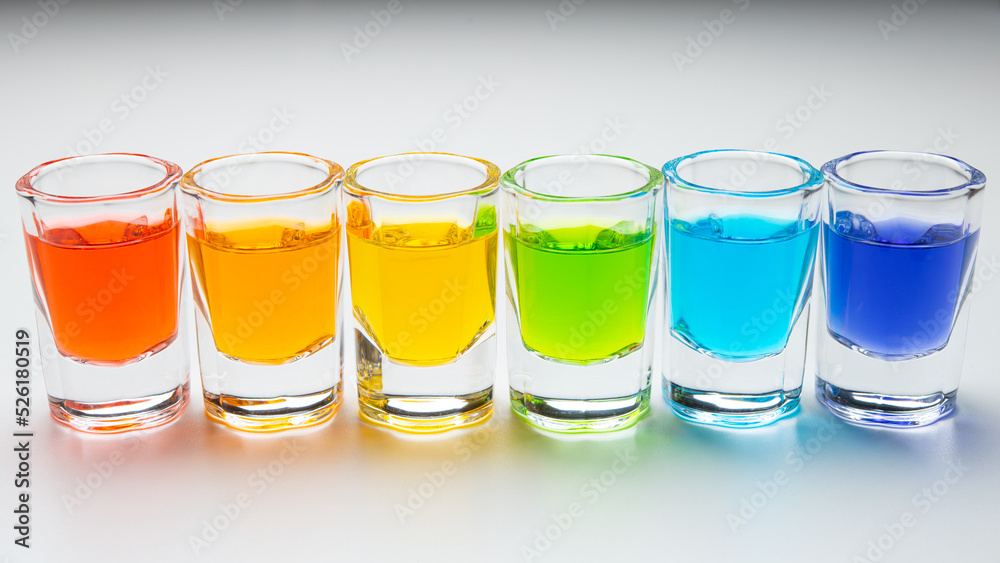 Rainbow drink. Glass of alcohol liquor. Bar counter. Rainbow colors. Colored Cocktail. LGBT Pride. Rainbow flag, symbol gays and lesbians LGBT, LGBTQ. Good for Party. High quality and resolution photo Rainbow drink. Glass of alcohol liquor. Bar counter. Rainbow colors. Colored Cocktail. LGBT Pride. Rainbow flag, symbol gays and lesbians LGBT, LGBTQ. Good for Party. High quality and resolution photo