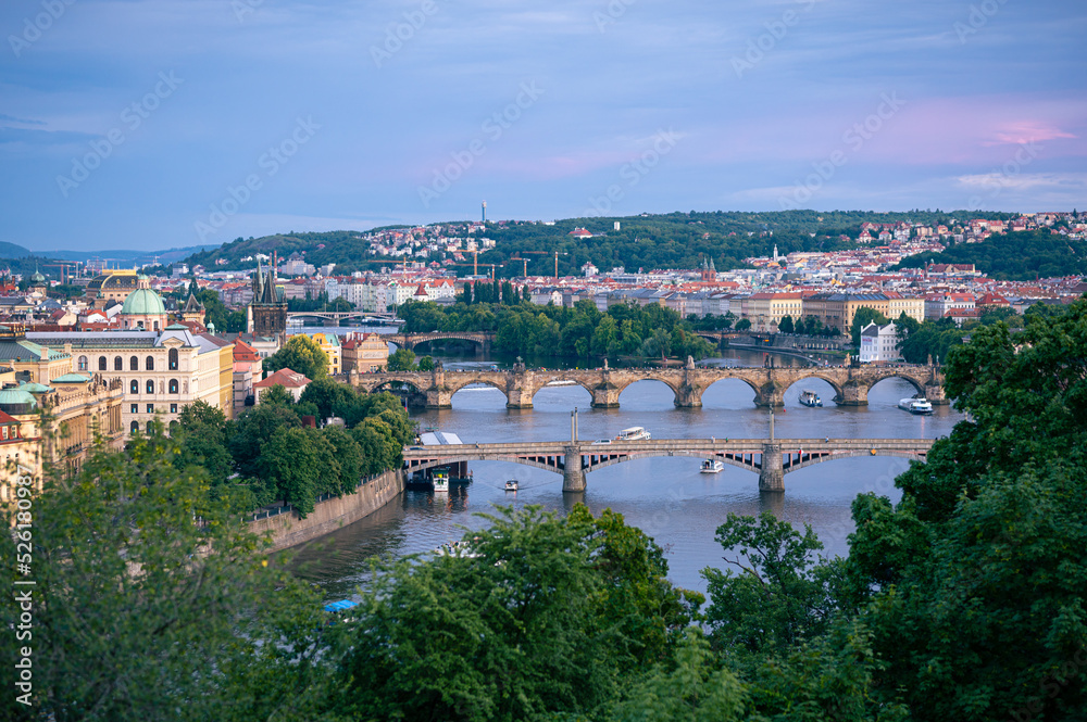 Famous bridges over Vltava River in the city of Prague in the evening
