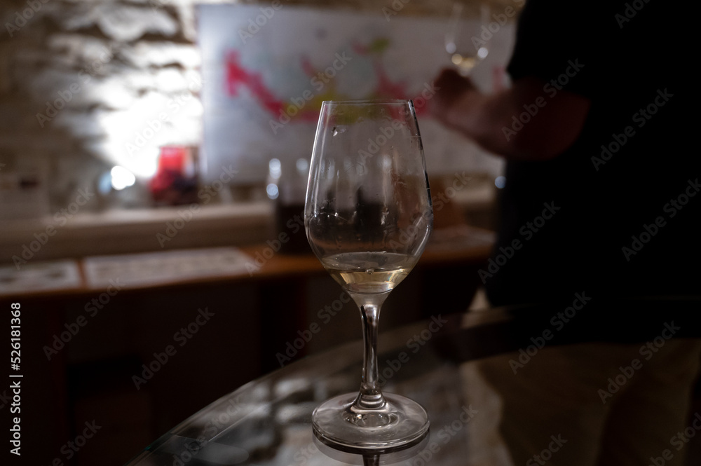 Wine tasting in underground cellars caves of French wine domain in Puligny-Motrachet village, Burgundy, France Wine tasting in underground cellars caves of French wine domain in Puligny-Motrachet village, Burgundy, France