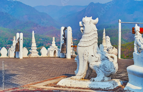 The Chinthe lion and belfry of Wat Phrathat Doi Kong Mu Temple, Mae Hong Son, Thailand photo