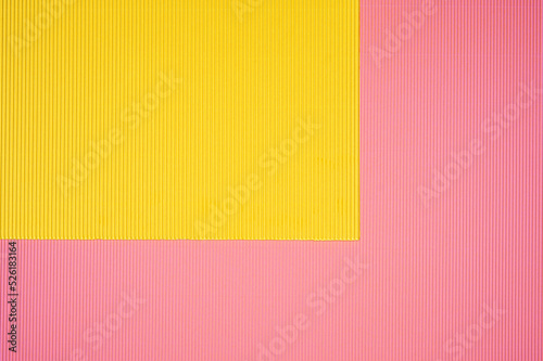 Pink and yellow two tone color paper background with stripes. Abstract background modern hipster futuristic. Texture design