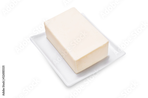 Fresh butter briquette on a white isolated background