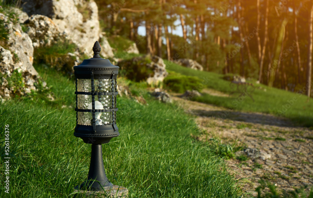 Garden lantern on the lawn, on a clear sunny day