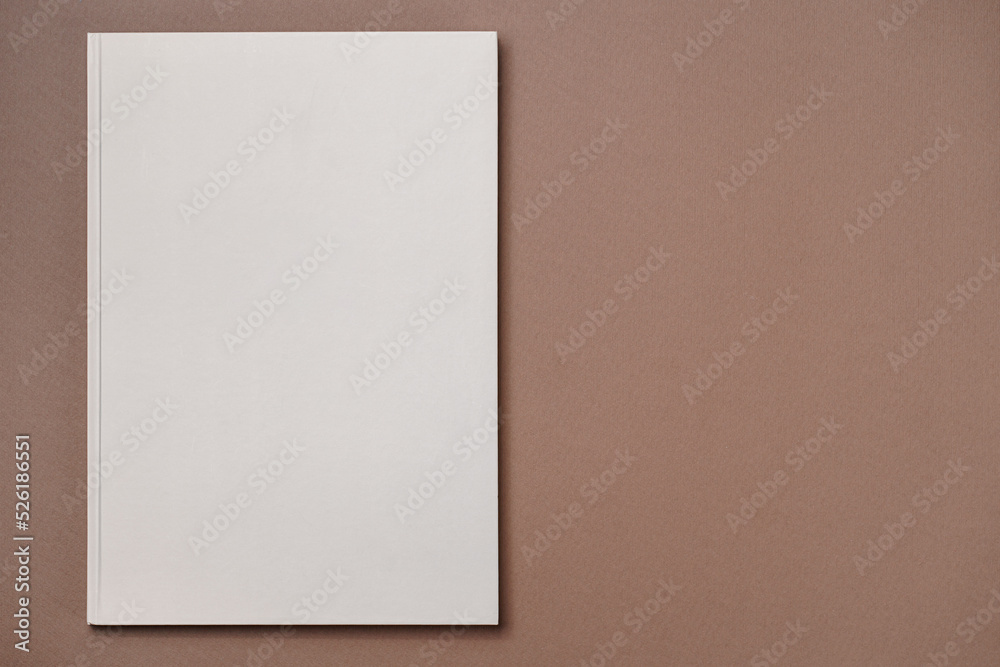 Gray Leather notebook on paper brown background, notepad mock up, top view shot Gray Leather notebook on paper brown background, notepad mock up, top view shot