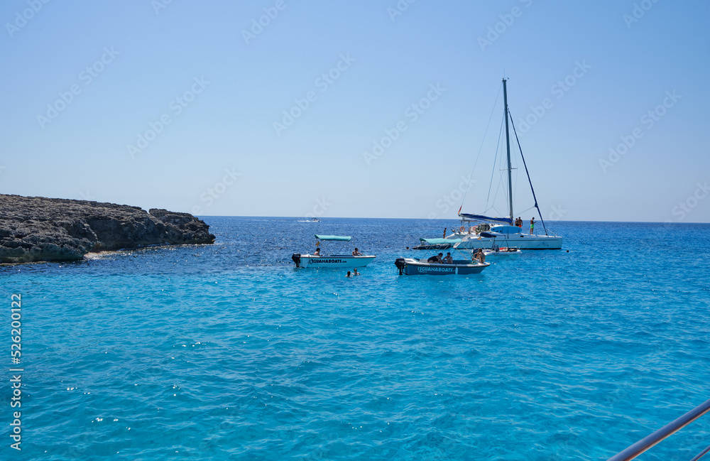 Obraz premium Menorca, Spain: Beautiful bay with sailing boat catamaran