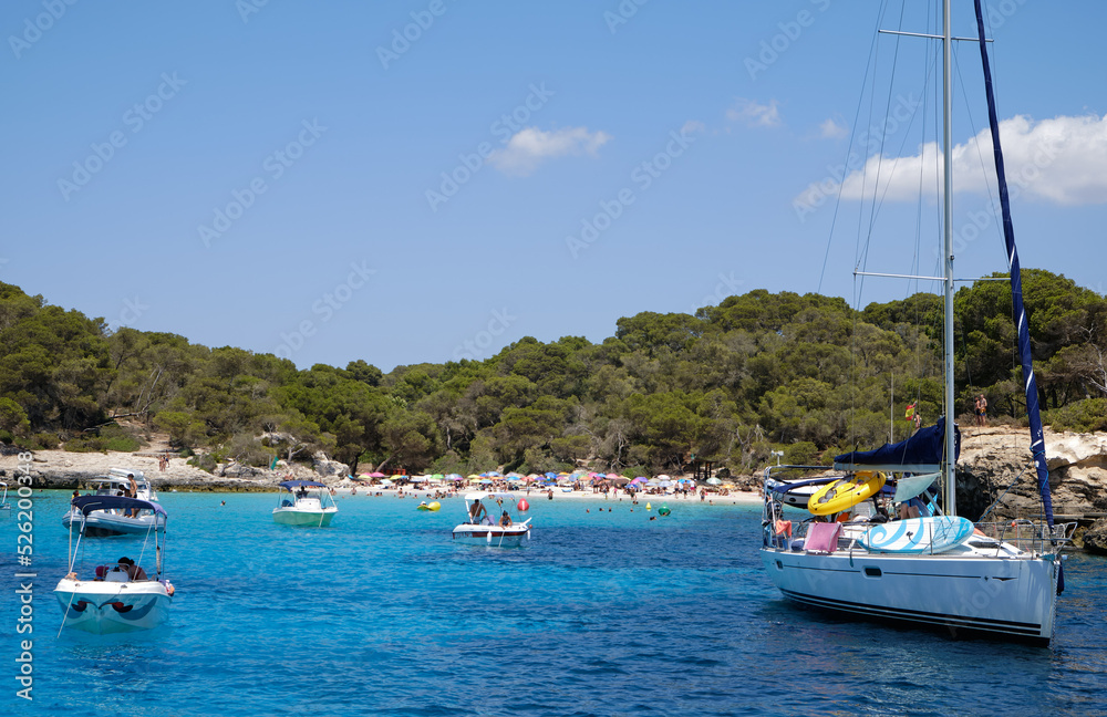 Menorca, Spain: Beautiful bay with sailing boat catamaran