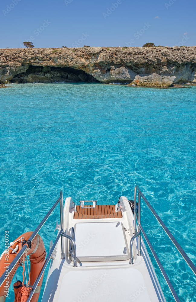 Fototapeta premium Menorca, Spain: Beautiful bay with sailing boat catamaran