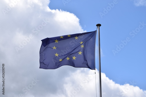 European Union flag on a cloudy day. EU banner in the wind