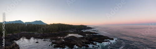 Ucluelet, Vancouver Island, British Columbia, Canada. Aerial Panoramic View of a Small Town near Tofino on a Rocky Pacific Ocean Coast during a cloudy and colorful morning sunrise.