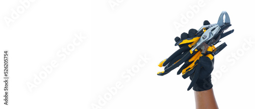 hand wearing black gloves holding different types of black yellow pliers isolated white background