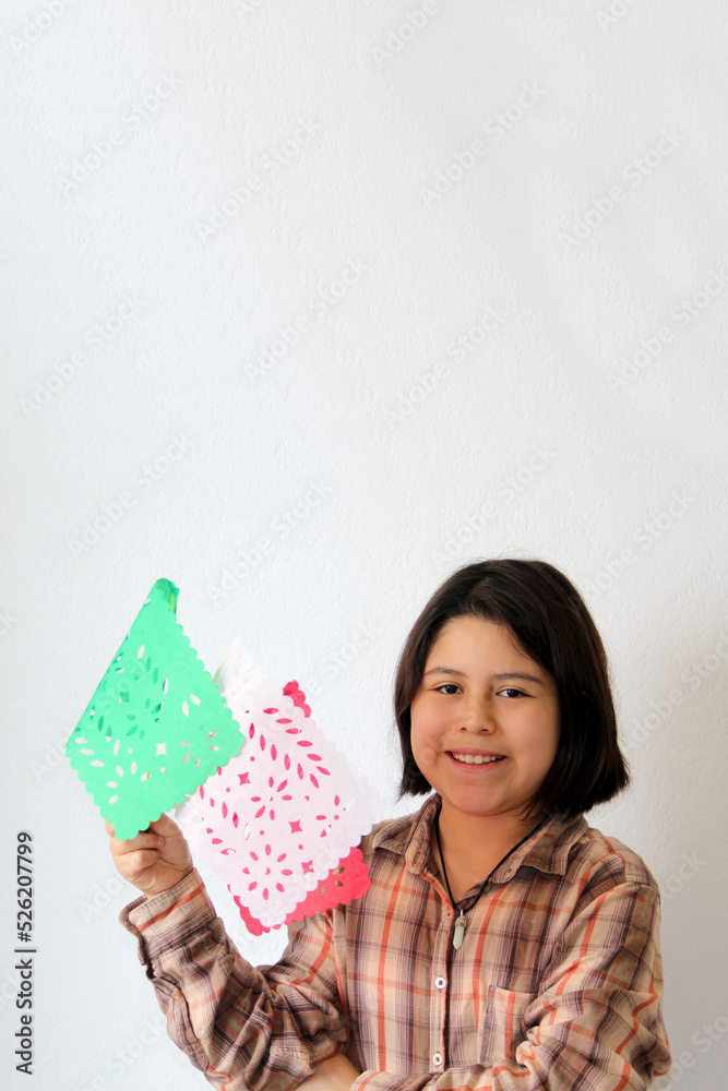 10-year-old Latina Hispanic girl plays with green white and red flags to celebrate the Mexican national holidays of May 5 and September 15
10-year-old Latina Hispanic girl plays with green white and red flags to celebrate the Mexican national holidays of May 5 and September 15