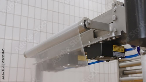 Feeding rolled food grade polyethylene into packaging machine