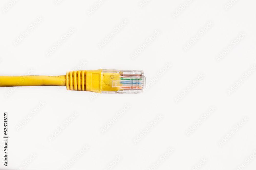 Yellow network cable on white background with space for text. Yellow network cable on white background with space for text.