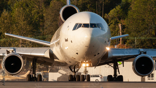 A UPS MD-11 front shot taxiing at Boeing Field in the evening.