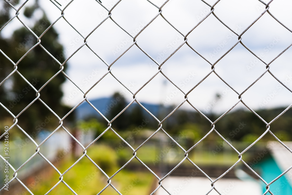 aluminum protection fence with green landscape behind aluminum protection fence with green landscape behind