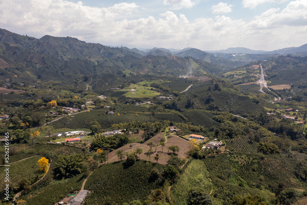 View from a drone of an area of agricultural farms between mountains in the department of Caldas. Colombia. View from a drone of an area of agricultural farms between mountains in the department of Caldas. Colombia.