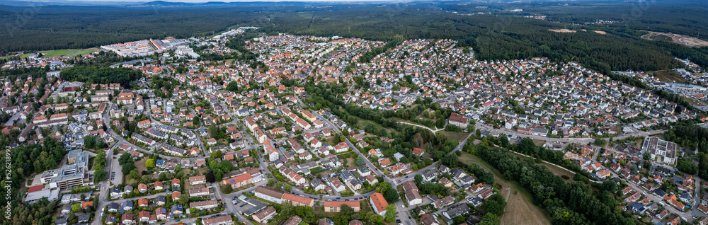 Aerial view of the city Feucht in Germany, Bavaria on a cloudy day in summer.