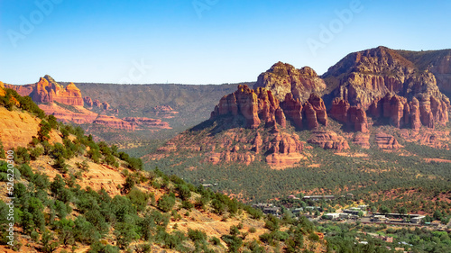 City and red rock mountain cliff and forest view at Airport Mesa Sedona Arizona