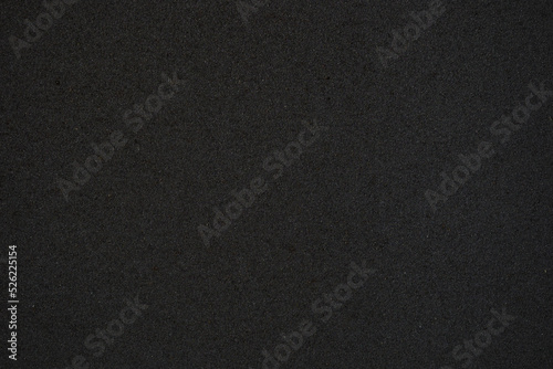Blank flat surface of gray color. Dark background with fine texture. Advertising background for ads or desktop wallpapers solid dark color. Minimalism in design.
