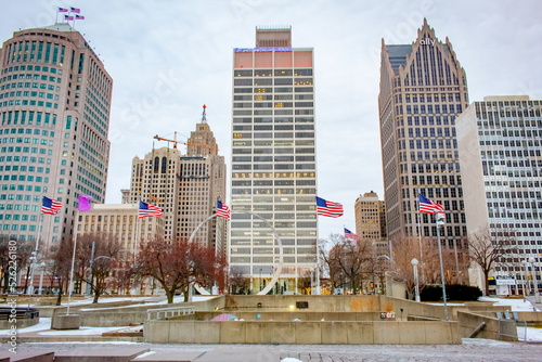 Downtown Detroit Michigan city buildings and American flags at Hart Plaza on a cloudy winter snow day photo