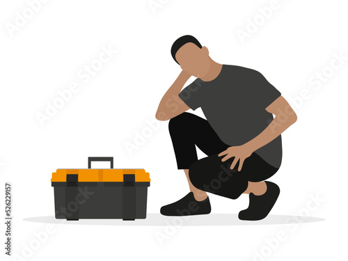 Thoughtful man squatting near toolbox on white background