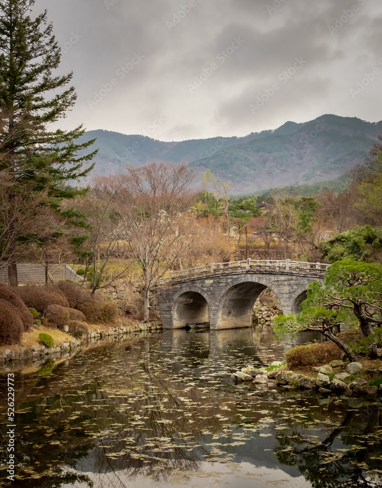 Stone bridge mountain fall forest trees view at Bulguksa Buddhist temple in Gyeongju South Korea.