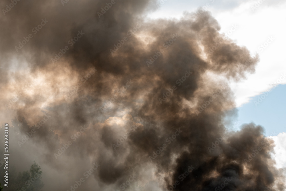Dramatic black smoke from a fire. danger, alarm, threat. Dramatic black smoke from a fire. danger, alarm, threat.